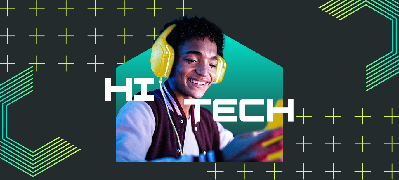 HI TECH. Young adult sits using their phone smiling at the screen on a dark grey background.