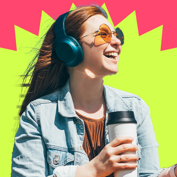 Young adult smiling wearing headphones