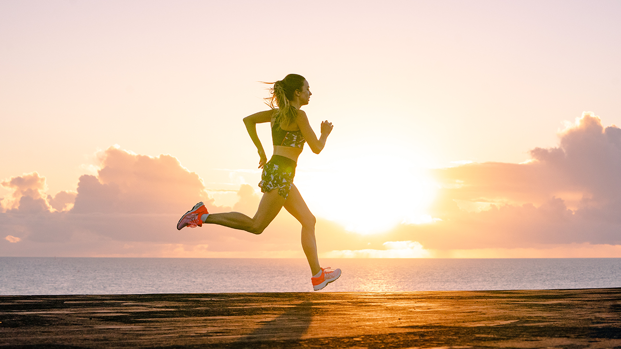 Exercises with sunrise. Beautiful disabled athlete woman in